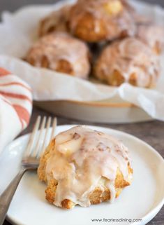 a white plate topped with donuts covered in icing