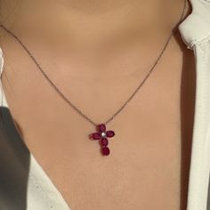 "A timeless and classic design, symbolizing faith and love. Perfect for everyday wear or dressed up for special occasions. Make a bold statement in our Genuine Ruby and Diamond Cross Pendant, available in 14k solid white gold and 14k solid yellow gold. 14k solid white gold chain and 14k solid yellow gold chain available for additional purchase to match your beautiful pendant. Item Specifications: Materials: 14k Solid Gold  Gemstone: Natural Rubies Pendant Diameter 16.7 mm x 12.3 mm Total Gold Weight: 0.89 ct. Total Ruby Weight: 1.77 ct.  Total Diamond Weight: 0.04 ct. Diamond Clarity: SI 1-2  Diamond Color: G color Necklace: Adjustable 16 and 18 inches with a lobster clasp Chain Weight: 0.6 mm 1.35 grams  ★  Each order will be beautifully packaged in a jewelry box and comes with a drawstri Yellow Gold Ruby Pendant Jewelry, Ruby Pendant In Yellow Gold, Gift Cross-shaped Diamond Necklace With Prong Setting, Ruby Cross Pendant, Red Gemstone Jewelry With Square Pendant, Ruby Pendant, White Gold Chains, Diamond Cross, Diamond Cross Pendants