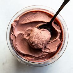 a bowl filled with chocolate ice cream and a spoon