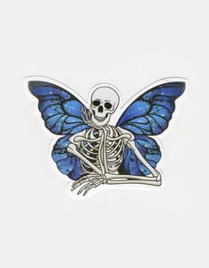 a sticker with a skeleton sitting on it's back and blue wings, in the shape of a butterfly