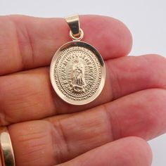 Our lady of guadalupe medal 14k yellow gold is the perfect way to show your special someone how much they mean to you! This classic and sturdy Genuine solid 14k solid gold medal is a work of art and truly unique while still appealing to everyone. It conveys the unconditional love and protection of Our Lady of Guadalupe beautifully while also being practical and long-lasting. This our lady of guadalupe medal 14k yellow gold is crafted with only the highest quality materials, including 14K genuine Saint Juan Diego, Gold Virgin Mary Necklace, Mary Necklace, Juan Diego, Virgin Mary Necklace, Beautiful Symbols, Our Lady Of Guadalupe, Lady Of Guadalupe, Mexican Culture