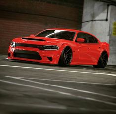 a red car parked in an empty parking lot