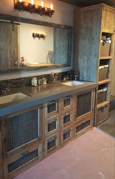 a bathroom with two sinks and wooden cabinetry in it's centerpieces