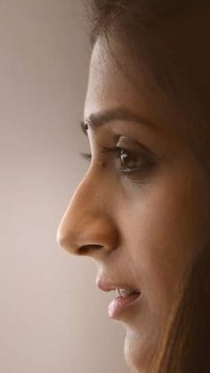 a close up of a woman's face and nose