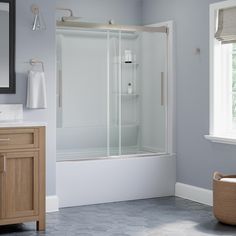 a bathroom with gray walls and white fixtures