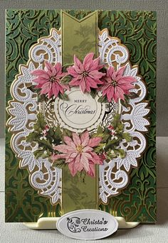 a christmas card with poinsettis and lace