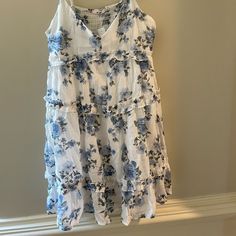 Beautiful Blue And White Floral Print Mini Dress From Francesca’s. New With Tags. Medium. Perfect For An Afternoon Stroll Through The Vineyards Or A Night On The Town! Blue Floral Print Sleeveless Dress For Daywear, Blue Floral Sleeveless Dress For Daywear, Blue Tiered Sleeveless Summer Dress, Blue Tiered Sleeveless Dress For Beach, Blue Tiered Sleeveless Dress For Summer, Blue Tiered Sleeveless Dress For Spring, Velvet Green Dress, Striped Beach Dress, Burgundy Mini Dress