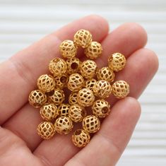 Round filigree gold metal beads, filigree gold beads, textured beads, necklace beads, matte gold beads, round gold beads, ball beads 8 mm round Please choose the quantity you want! More round findings? https://www.etsy.com/shop/EastVillageSupply/items?ref=l2-shopheader-name&search_query=round More filigree findings? https://www.etsy.com/shop/EastVillageSupply/items?ref=l2-shopheader-name&search_query=filigree More ball beads / findings? https://www.etsy.com/shop/EastVillageSupply/items?r Luxury Traditional Round Beads, Luxury Round Bead Metal Jewelry, Luxury Gold Plated Round Bead Jewelry, Luxury Gold Plated Jewelry With Round Beads, Cheap Trendy Gold Beads, Cheap Gold Dangling Beads, Luxury Statement Gold Beads, Temple Necklace, Bead Ball