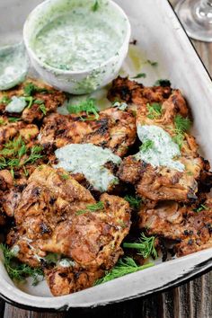 chicken wings with tzatzh and sauce in a casserole dish