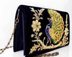 Peacock embroidered black velvet clutch, zardozi evening bag, side view. Velvet Bags For Festivals And Gifts, Gold Embroidered Evening Bag For Gift, Traditional Velvet Bags For Gifts, Traditional Velvet Bags As Gifts, Gold Velvet Bag For Gifts, Embroidered Velvet Bags For Festivals, Embroidered Velvet Bag For Festivals, Gold Velvet Gift Bag, Traditional Hand Embellished Bags For Gifts