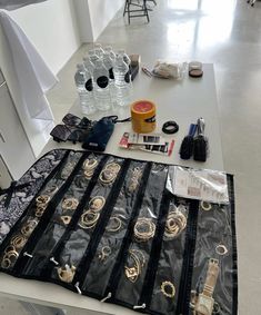 the table is covered with jewelry and other items