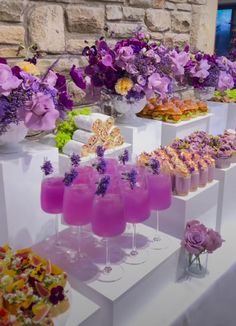 an assortment of desserts and drinks on display at a wedding or bridal event