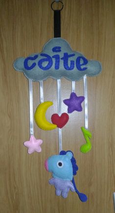 the door is decorated with an elephant, giraffe and stars