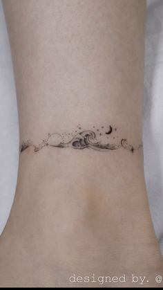 a woman's foot with a small wave tattoo on the side of her ankle