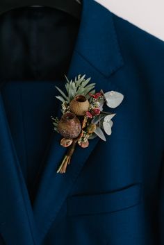 close up photo of an Australian native flower buttonhole Australian Native Flowers Wedding Bridal Bouquets, Wedding Bouquets Australian Natives, Australia Native Bouquet, Australian Native Flowers Wedding Buttonhole, Australian Native Boutonniere, Banksia Wedding Bouquet