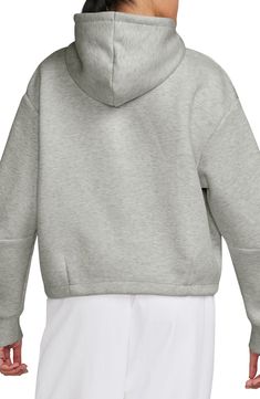 Made from the brand's premium lightweight fleece, this sporty hoodie is cut in a slightly cropped silhouette with dropped shoulders and a relaxed fit. 21 1/2" length (size Medium) Drawcord-toggle hood Kangaroo pocket 53% cotton, 47% polyester Machine wash, tumble dry Imported Gym Hoodie With Ribbed Cuffs, Nike Moisture-wicking Athleisure Hoodie, Sportswear Hoodie For Gym, Oversized Athleisure Sweats For Sports, Nike Activewear Sports Hoodie, Nike Activewear With Drawstring Hood For Gym, Nike Athleisure Hoodie For Streetwear, Nike Sporty Hoodie For Gym, Nike Sporty Hoodie Activewear