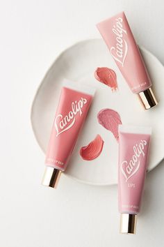 With just a hint of sheer color, this hydrating balm leaves your lips with a tinted shine. Perfect Nude: true nude Rose Sheer: glowing, sheer red Rhubarb: soft coral About Lano While wishing for the perfect balm to soothe her ultra-dry lips, Kirsten Carriol recalled her grandparents' farm where she spent her childhood petting the sheep covered in lanolin-coated wool. Realizing the miracle wax that hydrated their skin could work for hers as well, she created Lano a line of lip, hand and body balm Lip Tint Photography, Lano Lips, Tint Photography, Fashionable Wallpaper, Lipstick Photography, Cosmetics Packaging, Product Inspiration, Homemade Lip Balm, Kawaii Makeup