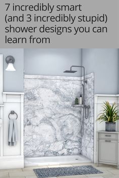 a bathroom with marble walls and flooring, including the shower area is shown in white