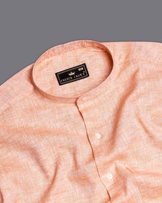 This Mandys Peach Linen Shirt is a high-quality garment made from premium linen material blended with pure cotton. The shirt features a soft and breathable fabric with a mandarin collar that provides superior comfort and a regular fit. The peach color adds a touch of sophistication, making it a versatile and stylish addition to any wardrobe. Fused collar and cuffs, collar stand and flat felled side seams provide structure and stability to all our shirts. Linen-Cotton blend: The structure and dur Casual Linen Shirt, Linen Material, Peach Color, Luxury Linen, Shoulder Shirts, Pure Linen, Mandarin Collar, Full Sleeve, Linen Shirt