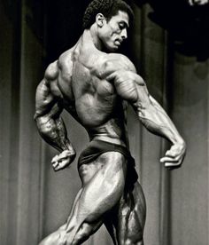 a black and white photo of a bodybuilding competitor