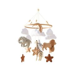 a wooden mobile with animals and clouds hanging from it's sides, on a white background