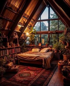 an attic bedroom with a bed, bookshelf and lots of plants in it