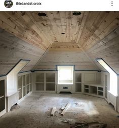 an empty room with unfinished wood walls and windows in the ceiling is being remodeled by thrandst crox