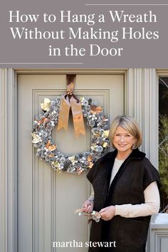 a woman standing in front of a door with a wreath on it and the words how to hang a wreath without making holes in the door