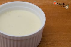 a white container filled with milk sitting on top of a wooden table