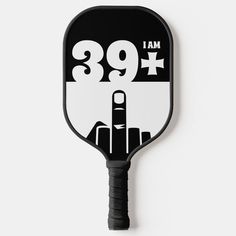 a black and white paddle with the number nine on it's side, which reads i am 69