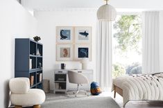 a bedroom with white walls and blue furniture