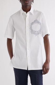 An ornate emblem adorns the chest of a cotton-blend button-up shirt designed with casually cuffed sleeves and side slits. Front button closure Point collar Elbow-length sleeves Side slits 78% cotton, 17% polyamide, 5% elastane Dry clean Made in Portugal Designer Clothing Luxury Cotton Shirt With Button Cuffs, Luxury Cotton Shirt With Button Closure, Luxury Cotton Tops With Buttons, Luxury Short Sleeve Formal Shirt, Luxury Button-up Shirt, Luxury Short Sleeve Cotton Shirt, Military Shorts, Elbow Length Sleeve, Fabric Gifts