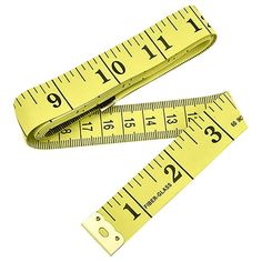 two yellow rulers with measuring tape on them