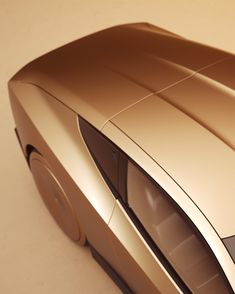 a gold colored car is shown from above