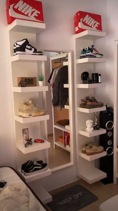 there are two shelves with shoes on them in the room and one shelf is empty