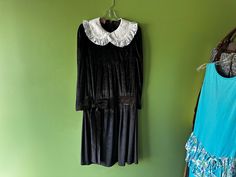 Perfect dress for a 20's costume or Wednesday Adams  Vintage Tag Size- no size marked Era- 80's Brand- hand made Condition- Good, light wear  Measurements taken flat  Bust 20 inches Hips and Waist 17 1/2 inches  Length 45 inches Important Information for buyers (Some may not apply) - Items are Vintage and may have flaws after years of love, all major and noticeable flaws are always listed and pictured but normal light wear may not be mentioned as it is expected with used and vintage pieces. - Sizes vary from decades and brands so please always check measurements before purchasing. - Color may very slightly online than in person as some screens show color differently than others. - Seller is not responsible for items lost in the mail. Wednesday Adams, 20s Costume, Etiquette Vintage, Dropwaist Dress, Drop Waist, Vintage Tags, Perfect Dress, Bridal Dresses, Bridal Gowns