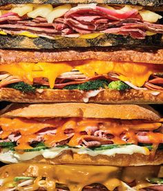 four different sandwiches stacked on top of each other with cheese, meat and broccoli