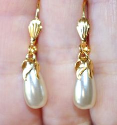 VINTAGE 14K GF 35 MM SATIN GOLDEN OFF WHITE TEARDROP JAPAN COATED PEARL LEVER BACK EARRINGS  WELCOME TO MY HANDMADE STORE: HAND MADE 14K GOLD FILLED 35 MM GOLDEN WHITE  PERFECT TEAR DROP WHITE / GOLDEN JAPAN COATED PEARL LEVERBACK EARRINGS THESE EARRINGS ARE HOBE OLD STOCK PEARLS FROM JAPAN. GOLDEN WHITE SMOOTH SHINY SATIN COLOR...BEAUTIFUL COLOR IN MY OPINION. SMOOTH SURFACE. THEY ARE OLD STOCK FROM HOBE COMPANY 16 MM  X 9MM NICE SIZE PEARLS BEADS NOTICEABLE SIZE PLEASE SEE PHOTOS YOU WILL LOVE WEARING THEMPrivacy policy, return policy; If you are returning the merchant just because you did not like it, you will have to pay for return ship. option 1 ; you can either have a gift card for full refund so you can use it for another purchase in my shop. option 2; If you want a money back, ther Leverback Earrings, Satin Color, In My Opinion, Tear Drop, Pearl Beads, Jewelry Earrings Dangle, Gold Filled, Etsy Earrings, Dangle Drop Earrings