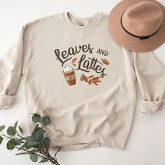 Our fall leaves and pumpkin spice latte coffee cup shirt is a great addition to your fall tee collection! Perfect for all of your fall activities: grabbing coffee, hanging out at the ball field, or under a cute jacket or sweater by the bonfire! Makes a great gift too! SIZE UP for an OVERSIZED FIT (see size chart in listing photos). Are you looking for additional Fall or Halloween themed graphic tees? Check out the following: https://www.etsy.com/shop/TheGraphicPeach?ref=seller-platform-mcnav§ion Relaxed Fit Coffee Color Tops For Fall, Coffee Colored Tops With Letter Print For Fall, Coffee Letter Print Tops For Fall, Fall Coffee Cotton Sweatshirt, Fall Cotton Coffee Sweatshirt, Coffee-colored Graphic Print Sweatshirt For Fall, Coffee Cotton Sweatshirt For Fall, Coffee Color Cotton Sweatshirt For Fall, Casual Coffee Sweatshirt For Fall