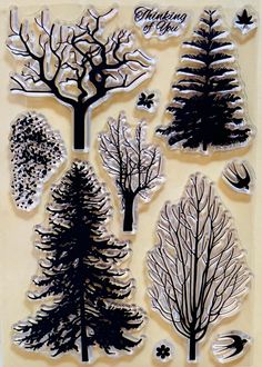 a stamp set with trees and leaves on the bottom, one is black and white