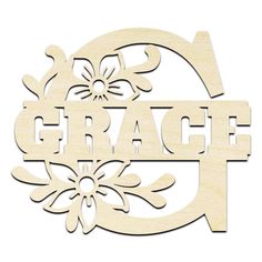 a wooden sign that says grace with snowflakes on the bottom and an arrow above it