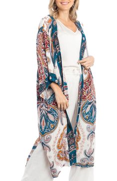 Love to layer all of your look in this bohemian-inspired duster that is covered in a bright medallion pattern. Open front Short sleeves 100% rayon Hand wash, line dry Imported Model stats: 5'10", 32" bust, 25" waist, 36" hip. Model is wearing size One Size. Bohemian Long Kimono With Paisley Print, Long Bohemian Kimono With Paisley Print, Bohemian Long Kimono With Vibrant Print, Bohemian Kimono With Paisley Print For Vacation, Long Bohemian Kimono With Vibrant Print, Bohemian Printed Summer Outerwear, Long Paisley Print Kimono For Festivals, Long Kimono With Paisley Print For Festivals, Bohemian Ikat Print Kimono For Summer