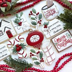 decorated christmas cookies and decorations on a table