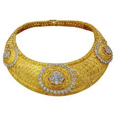 This gorgeous choker is expertly crafted in 18K yellow gold, and features three raised diamond motifs in the front. The backdrop for the motif of diamonds exhibits an intricate "scale" pattern with a Florentine finish. The necklace has a classical and regal presence. On the reverse side is a honeycomb gold gallery that also exhibits the expert quality workmanship of the maker. The combination of Florentine finish and its subtle pattern, make this amazing choker both versatile and wearable. The n Gold Gallery, Star Wars Celebration, Subtle Pattern, Regal Design, Scale Pattern, Gold Choker Necklace, Gold Choker, The Expert, Matching Bracelets