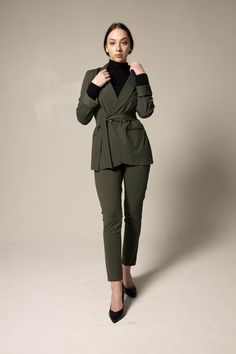 Level up your wardrobe with this double-breasted lapel blazer in a sophisticated cut for a trendy style - a  darted midsection creates a feminine fit for modern office style.    . Color: Olive 
. Length: 31 inches 
. Made in America 
. Care: Dry Clean 
. Composition: 59% Nylon, 41% elastane 
. Sizing: 
    • Fits true to size 
    • Designed for a regular fit 
    • Mid-weight, non-stretchy fabric 
    • Model is 5ft 8 in/ 172.72 cm, and wears a size Small (2) Olive Blazer, Belted Blazer, Lapel Blazer, Boys Bottoms, Office Style, Professional Outfits, Sweater Set, Modern Office, High End Fashion