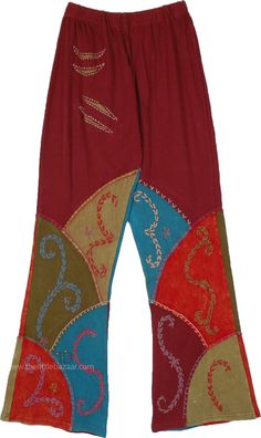 A funky 70`s style pants in cotton sinker fabric, with beautiful hand embroidery patterns on multi-color patchwork. These bohemian-style patchwork pants are crafted from knit cotton, making them ideal for comfort and style. #tlb #SplitSkirtsPants #Embroidered #bohemianfashion #Handmade #Tall #XLPlus #BohemianPants #TallPants Hippie Wide-leg Patchwork Pants, Hippie Wide Leg Patchwork Pants, Hippie Cotton Patchwork Bottoms, Hippie Style Cotton Bottoms With Patchwork, Hippie Style Patchwork Cotton Bottoms, Red Cotton Bottoms For Festival, Bohemian Cotton Bottoms With Patchwork, Red Cotton Hippie Pants, Hippie Red Cotton Pants