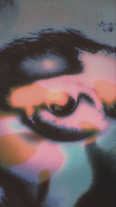 a blurry image of a person's face in the middle of an abstract painting