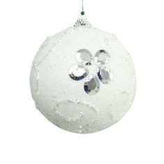 a white ornament hanging from a silver chain on a white background with snow flakes