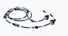 "Black Beaded Eyeglass Chain.  I created this beaded eyeglass chain with  with a variety of faceted glass beads ranging from 3mm Swarovski Crystal to 6mm faceted Czech glass beads, The chain is accented with black Lucite flowers, they look delicate but are very durable. Show off your joy of glitz and glam when you wear this wonderful eyeglass chain. Perfect for Fall! The lanyard is light weight and is designed with smooth comfortable beads at the neck, no pinching or chaffing. To attach the lanyard to your personal facial mask just clip each lobster claw clasp onto the ear loops and you are all set and in style!   Perfect for all day wear. Show off your sense of style with this wonderful and sophisticated Facial Mask Chain/Lanyard!  This is a wonderful gift for your friends, family, collea Beaded Eyeglass Chain, Beaded Lanyard, Chain Lanyard, Mask Chain, Beaded Lanyards, Eyeglass Holder, Eyeglass Chain, Glasses Chain, Facial Mask