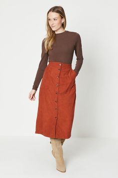 Introducing our stylish and versatile cord button-down midi skirt, perfect for the modern woman who values both comfort and fashion. This skirt is designed to keep you snug during colder days while maintaining a chic and casual look. Whether you're heading to the office or meeting friends for a coffee, this skirt effortlessly combines comfort and style, making it a must-have addition to your wardrobe. Christmas Party Shoes, Button Front Midi Skirt, Velvet Clothes, Sequin Outfit, Orange Skirt, Christmas Party Outfits, Oasis Fashion, Corduroy Skirt, Fashion Face